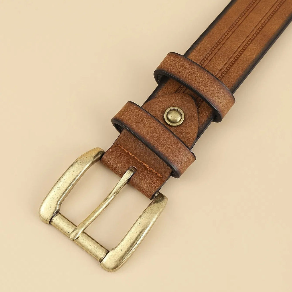 Close-up of the solid brass gold tone single prong roller buckle and keeper loop on the Sierra Oro Western belt