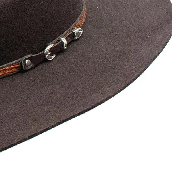 Close-up of the Dallas hat's tan tooled-leather band and silver buckle on brown wool felt
