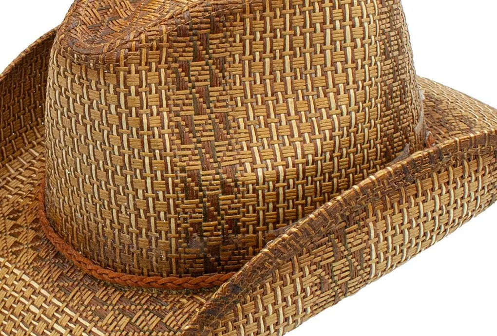 Close-up of the Stride hat's braided band and distressed toyo straw crown